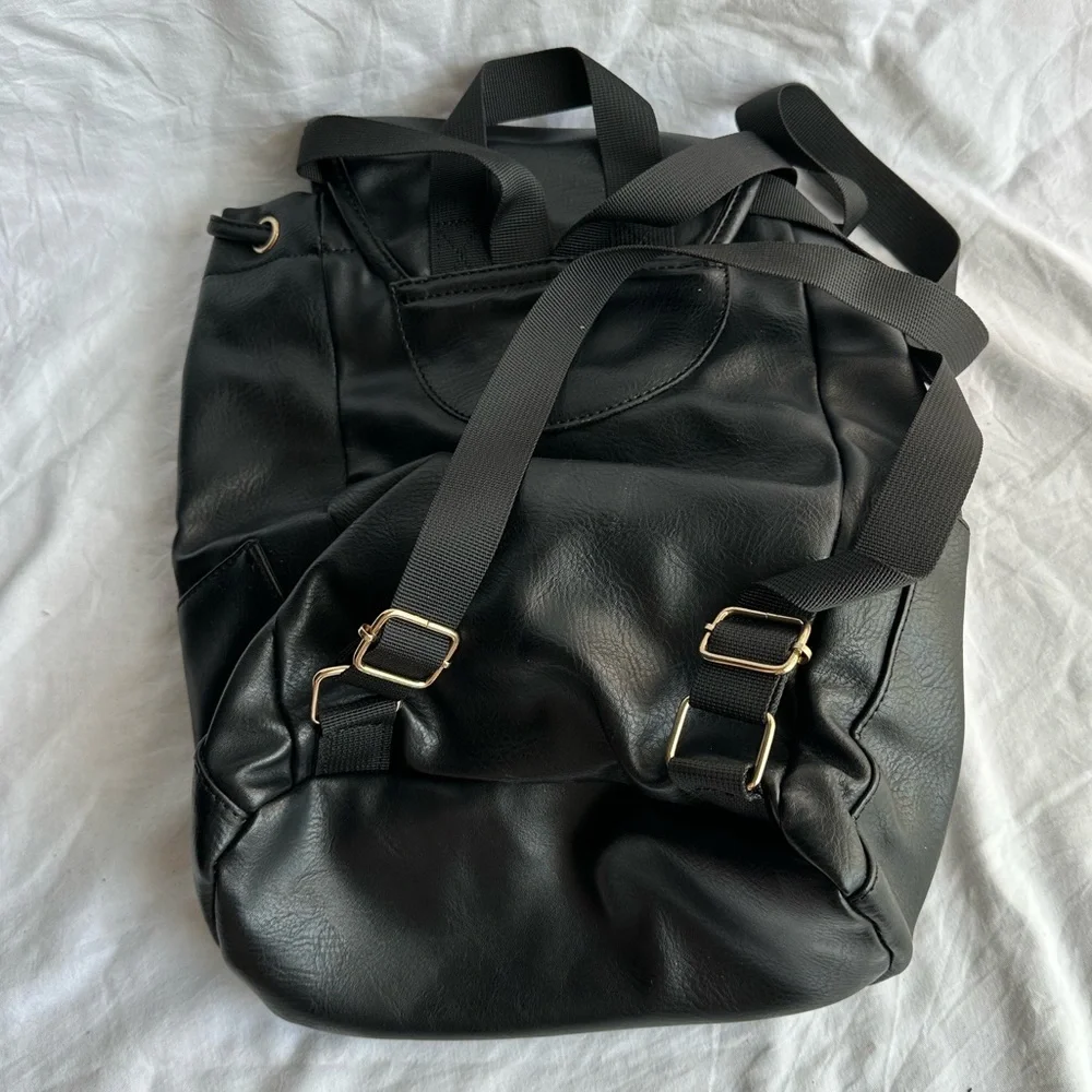 Black Faux Leather Drawstring Backpack with Gold Buckle Accent